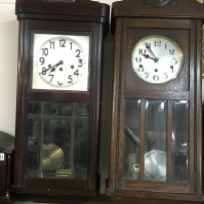 Two wall clocks. Both approximately 86cm tall and 32cm wide, Postage D.