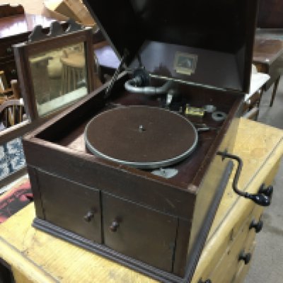 HMV gramophone with needles and a few vinyls. 38cm wide 46 deep and 35 high. Postage D