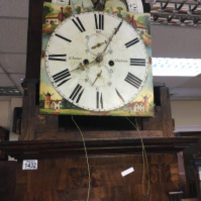 A mahogany long case clock the arch painted dial with Roman numerals.