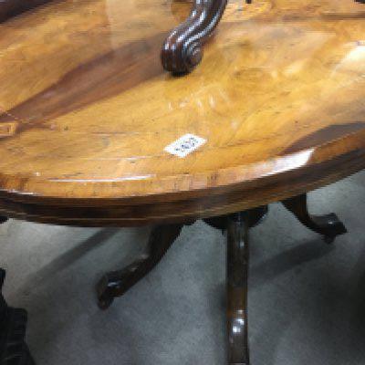 A Victorian walnut oval Loo table the turned column of cabriole legs .