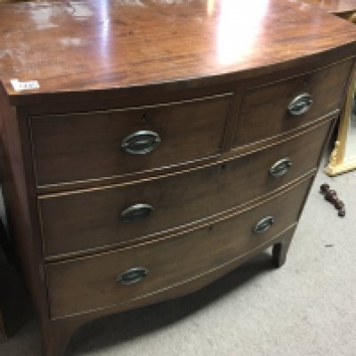 A late George III mahogany bow fronted chest of drawers fitted with two short and two long drawers on swept bracket feet nice original condition. Length 90cm