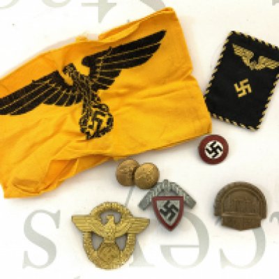 A small group of Nazi memorabilia to include a possible retrospective copy of a 1935&ndash;45. State Service Armband. Etc (A)