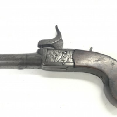 A percussion pocket pistol signed H.Nock, 14cm long. Postage category b