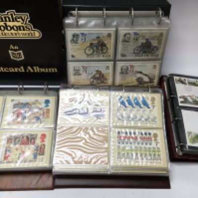 A collection of stamp post cards and an album of first day covers. Postage B