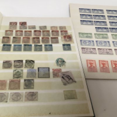 An album containing Victorian stamps including Two Pence Blues other useful Victorian and Edwardian stamps one other album of unused George VI and Elizabeth II pre-decimal stamps a selection of unused pictorial stamps and cards.