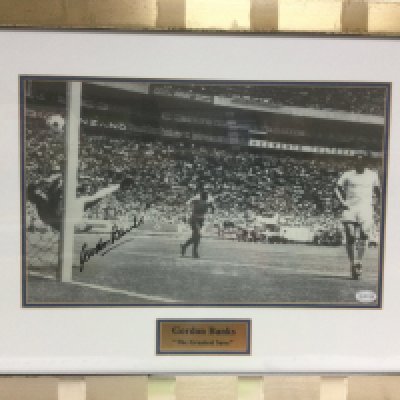 A framed and glazed signed print of Gordon Banks with COA, approx 60cm x 47cm. Shipping category D.