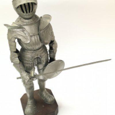 A miniature Medieval suit of armour with longsword and shield , 43cm tall. Postage category C