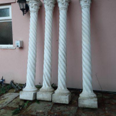 A set of six composition garden pillars free standing stylised Corinthian columns with acanthus leave capitals and spiral columns. Good condition not fixed to the ground so easy to collect sold in situ buyer to collect height 213cm high.