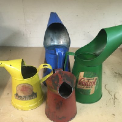 Four motor oil jugs
