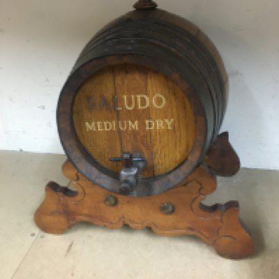 A vintage spirit barrel on stand , Saludo medium dry. Approximately 39cm tall