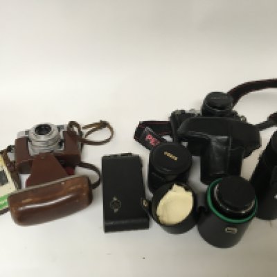 A Zeiss Ikon Contessa Camera three Ozeck telescopic lens a Pentax Camera and one other.