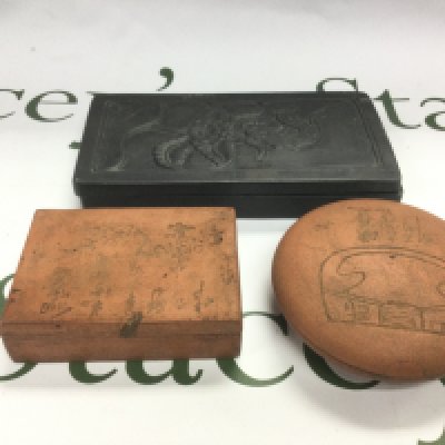 Three Oriental boxes comprising two terracotta examples and other. Shipping category D.