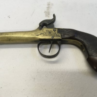 An Early 19th Century cannon barrel percussion with floral engraving and walnut grip. Makers stamp