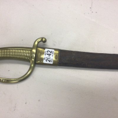 An Antique 19th Century Napoleonic Era Grenadier Briquet short sabre sword the brass guard stamped PDL 570 the steel blade with further marks with a leather scabbard.