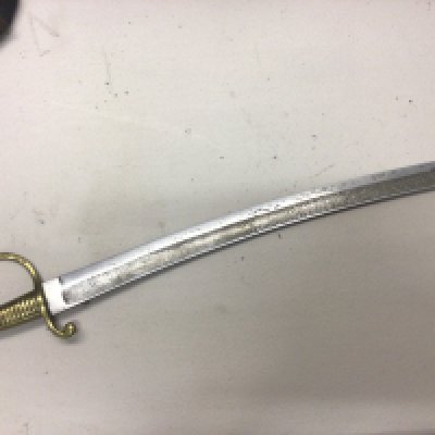 A French Napoleonic short sword with a brass grip steel blade.