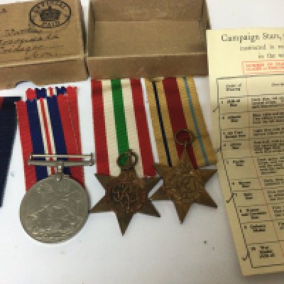 A group of four II world war medals awarded to C A Watkins war medal African star Italian star 1939-45 star with medal certificate and medal box.