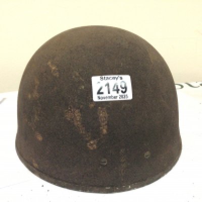 A II world war Military helmet most likely British Paratroopers Airborne division.