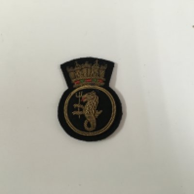 A collection of uniform badges consisting of very early type officers badge from the royal yacht association, Union castle/clan line shipping company cap badge, uniform badge from the civil defence corps, royal naval blazer badge circa 1950s, pair of original design jacket badges from the orient line and superb set of royal naval uniform badges