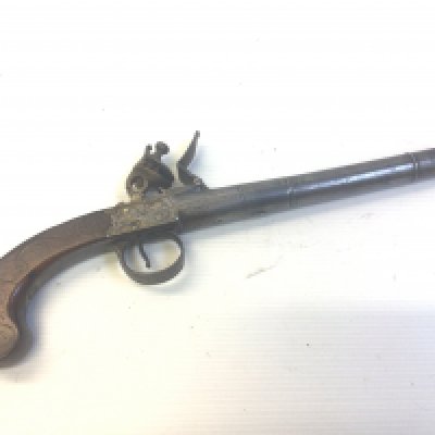 An 18th century flintlock pistol with extended cannon steel barrel the action stamped I Oiner London. The walnut grip with slivered inlay action functional proof marks to the barrel. Length 33cm