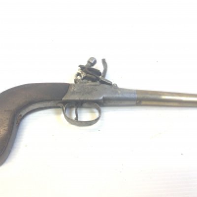 An early 19th century flintlock pistol with a brass tapering barrel.
