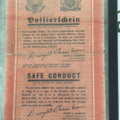 A II world war Military document German Soldier Safe Conduct. Given to surrendered German Soldiers post II world war facsimile signature Dwight D Eisenhower.