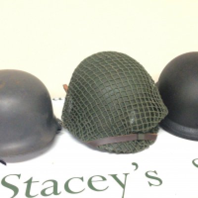 An American Military helmet a UN type helmet and a replica German II world war helmet (3)