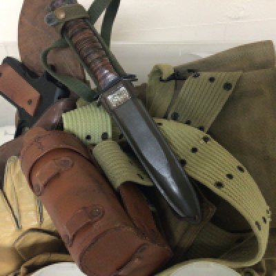 A collection of American II world war and latter webbing including a replica non firing revolver a USM8 combat Knife and associated items