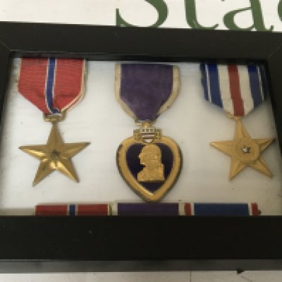 A group of three American Medals including a Purple Heart. In a fitted case