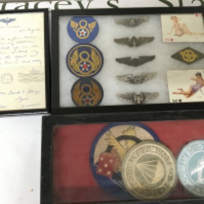 A group of American badges cloth badges and a letter dated 1945 framed. (3)