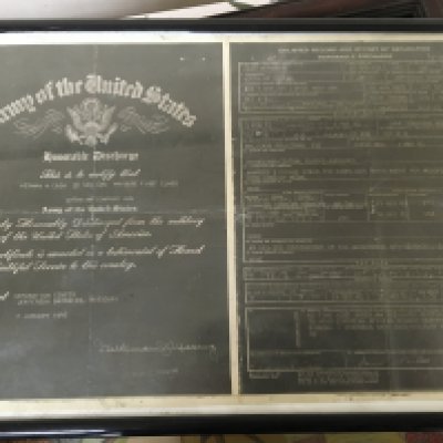A collection of American II world war ephemera product packaging and other American military related items in fitted cases and frames.