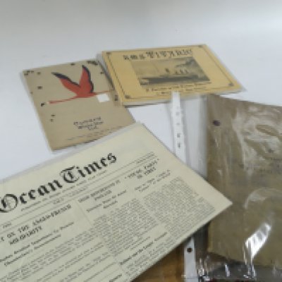 A collection of vintage maritime souvenir documents including Cunard White Star 1934 booklet, titanic postcards , reproduction titanic poster . Postage category B
