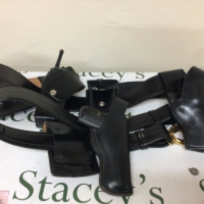 An American Police leather belt with handcuffs radio non firing replica Colt .380 and a baton.