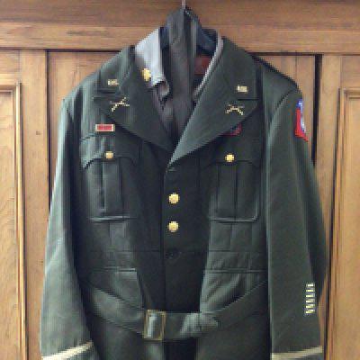 An American II world war Officers dress jacket with shirt trousers and tie badged US Airborne.