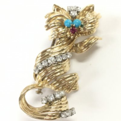 A mid century 18ct gold turquoise, ruby and approximately .9 carat diamond set cat Gubelin brooch. Total weight 16g Postage category A