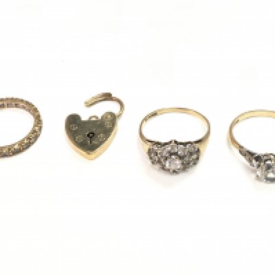 9 carat gold rings set with cubic zirconia stones and a heart pendant. Total weight 8.4g Postage category A