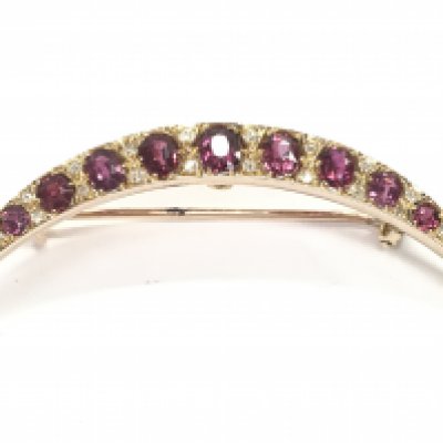 An antique 9 carat gold ruby and diamond crescent brooch, 5g postage category A
