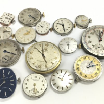 A collection of watch movements to include Tudor, Omega, Cyma. Postage category A