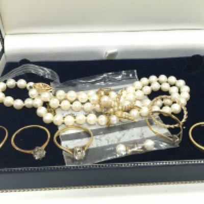 A Collection of gold jewellery including 18ct gold rings mostly set with diamond stones, an 18 carat gold pearl set bird brooch and a pearl necklace. Total gold weight 13.6g Postage category A