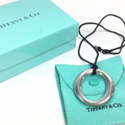 A silver boxed Tiffany and Co pendant. Postage category A