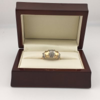 A yellow metal ring (tested 14ct) set with diamonds. Approx size S, Approx weight 6.8 grams.