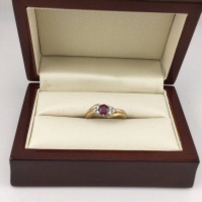 An 18ct ruby and diamond set ring. Approx weight 4.41 grams Approx size L.