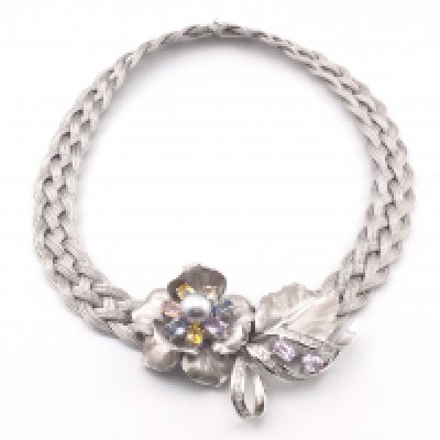 An 18k white gold necklace set with mixed sapphires and diamonds. Total weight is approximately 115g and diameter 6inches.Postage B