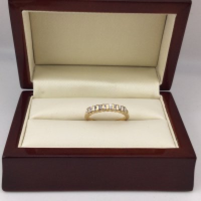 An 18ct diamond set ring with baguette and brilliant cut diamonds.