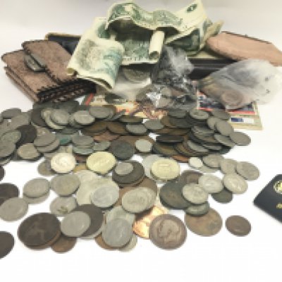 A collection of British coins including pennies, shillings, one pound notes. Postage cat c