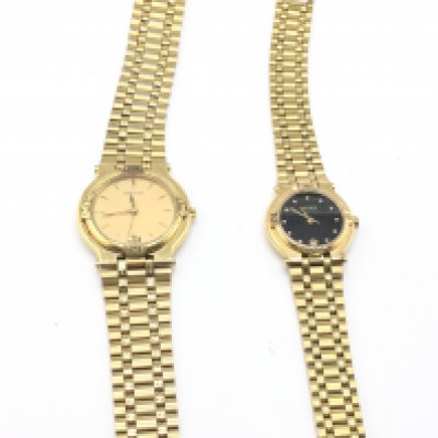 A his and hers gold plated Gucci watches. Postage B