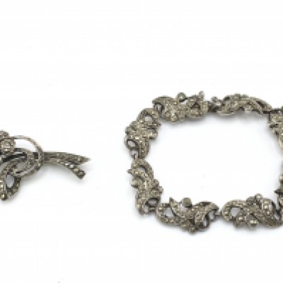 WITHDRAWN - A silver bracelet and a silver brooch set with pearl. Postage B. NO RESERVE