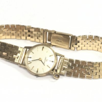A 9 carat gold Omega ladies watch. 30g. Postage category a