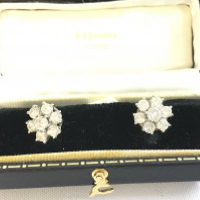 A pair of 18ct white gold cluster earrings. Approximately 11mm diameter. Postage B
