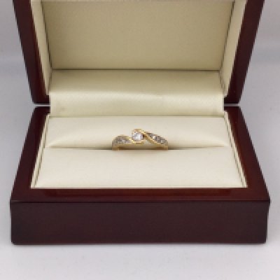 An 18ct gold diamond set ring approx .33 cts. Approx weight 3.9grams, approx size M1/2.