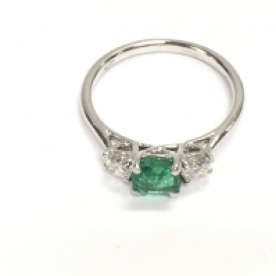 An 18ct white gold square cut emerald and diamond ring. Emerald 0.66ct and 0.37ct diamonds. Size L 1/2 and 2.34g